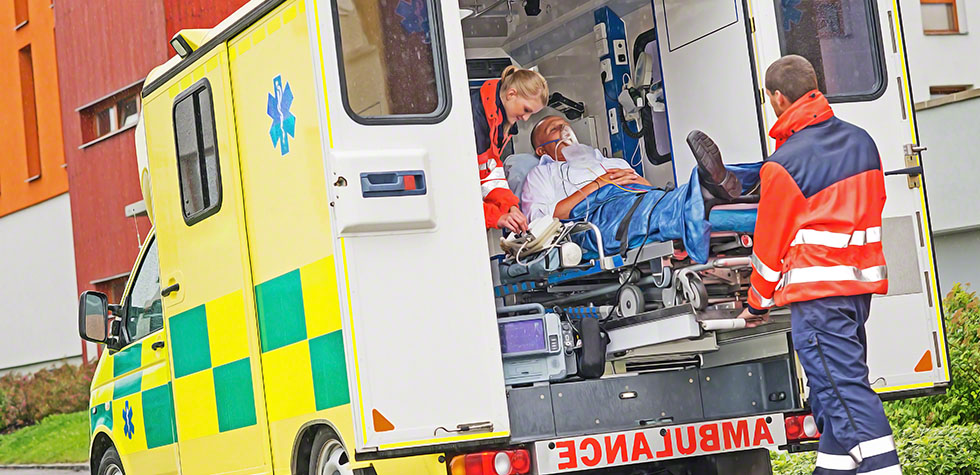 Paramedics putting patient in ambulance car aid | Frog feed blog
